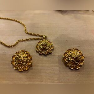 Vintage gold tone lion head necklace and pierced earrings.
